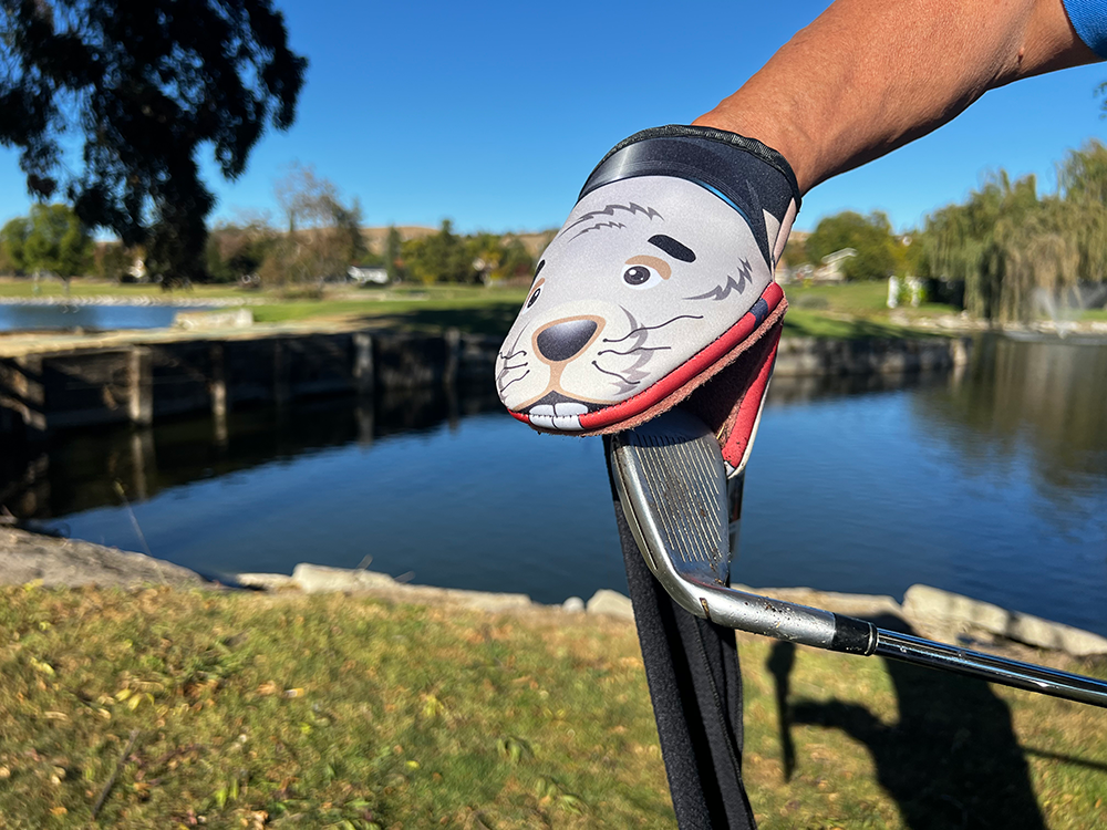 Image of Gopher Product cleaning a dirty golf club iron