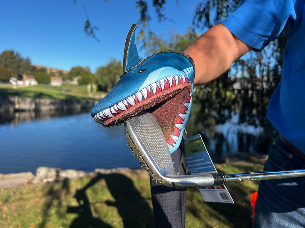 Photo of Shark Product cleaning a dirty golf club iron