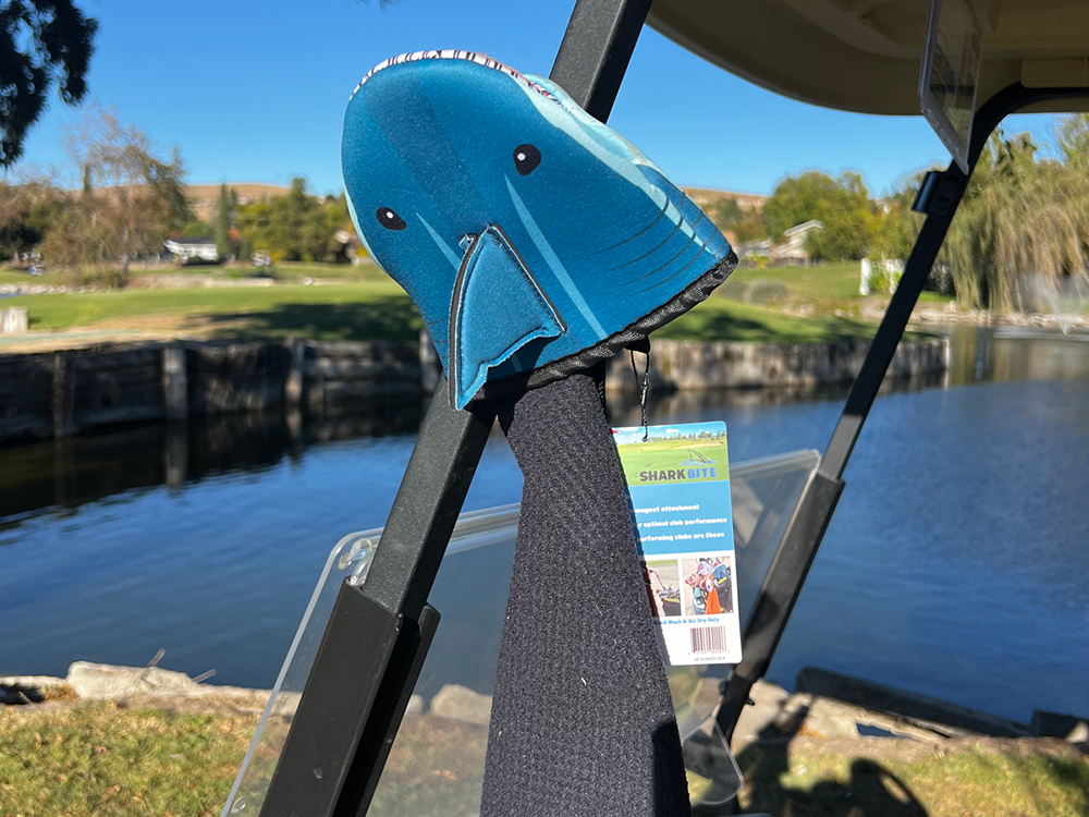 Photo of Shark Product showcasing the magnetic feature attached to the metal frame of a golf cart
