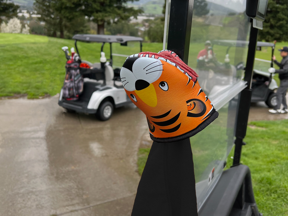 Photo of Tiger Product showcasing the magnetic feature attached to the metal frame of a golf cart